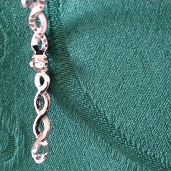 SILVERTONE TWISTED HOOP EARRINGS WITH ZIRCONS HINGED FOR PIERCED EARS - Picture 3 of 5